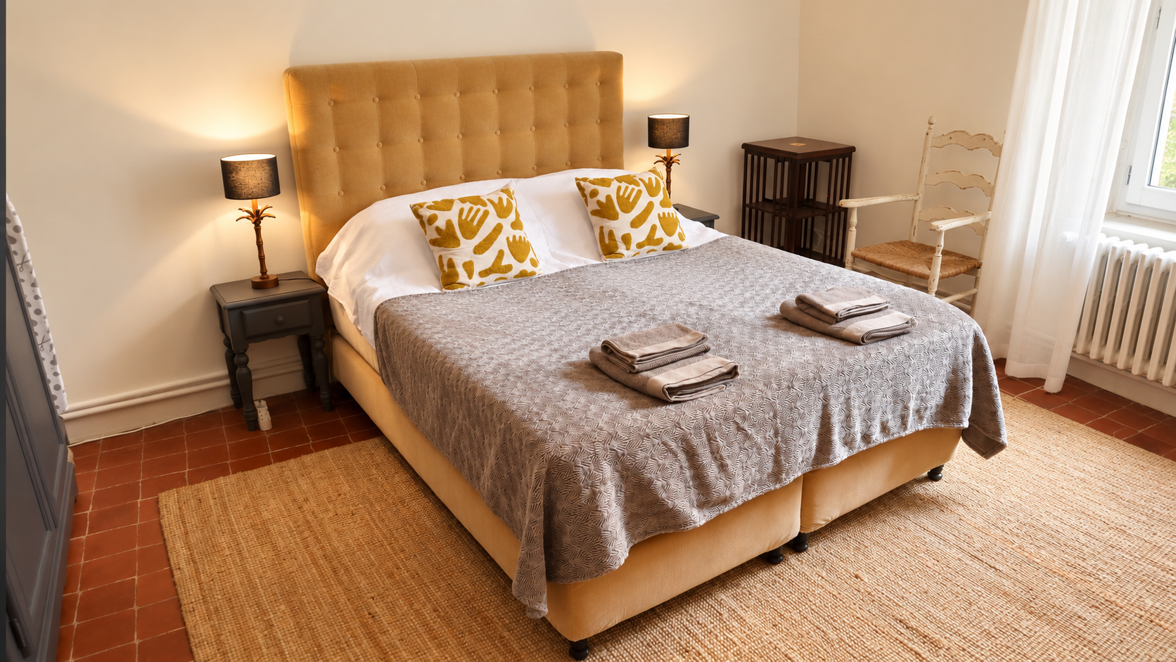 Double bedroom with an ochre headboard